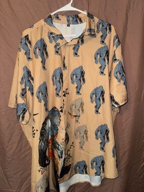 Beige Short-Sleeve Button-Up Shirt with Blue Sasquatch Graphic Pattern